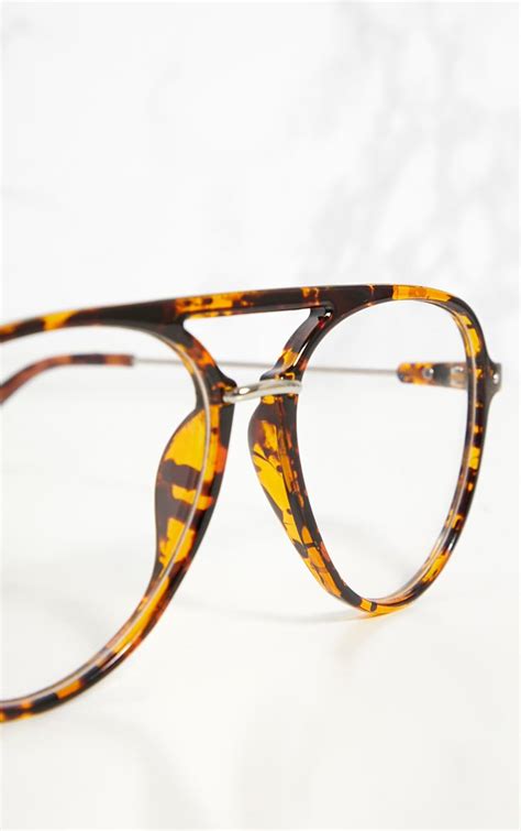 clear glasses with tortoiseshell rim.